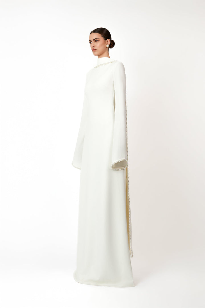 long-sleeve gown with draped pearl-trimmed cape – IVORY GRACE