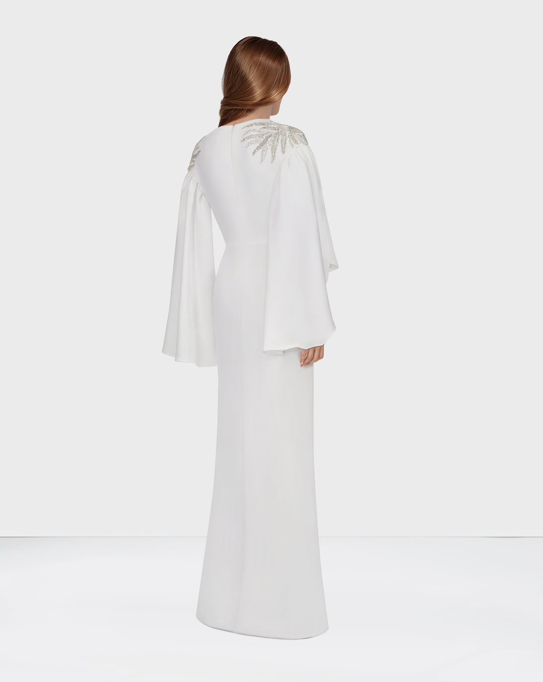 White column dress with ruffled sleeves and sequined shoulders