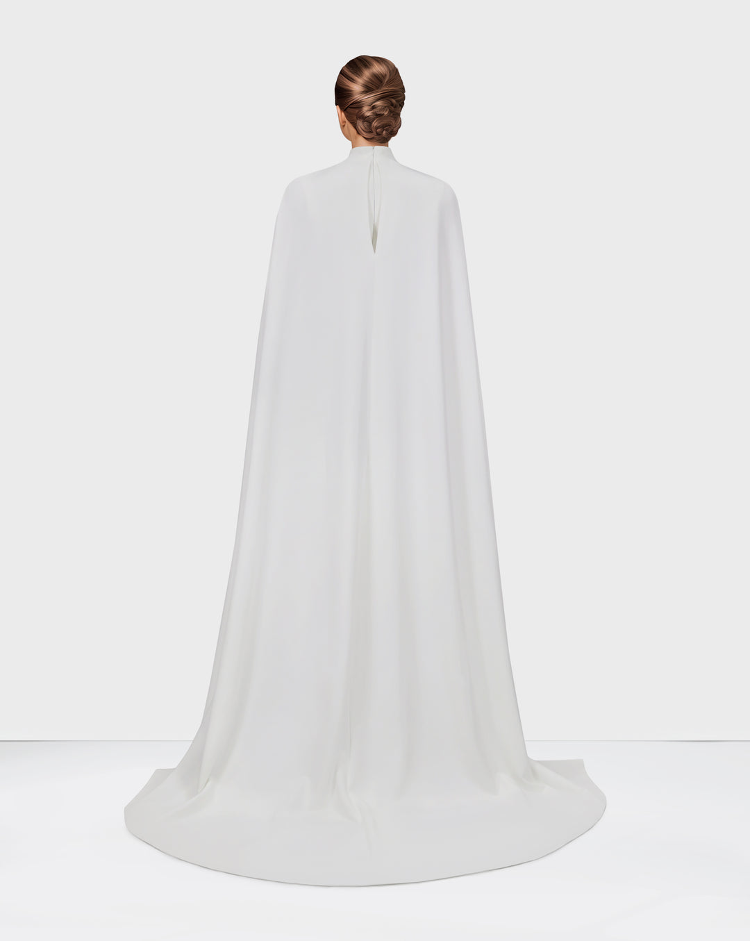 White pleated dress with neckline and cape