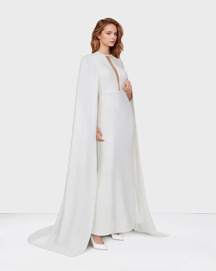 White dress with neckline and cape
