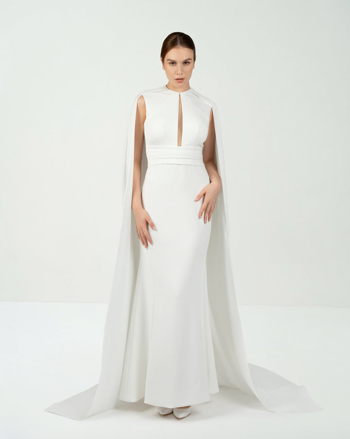 White belted dress with neckline and cape