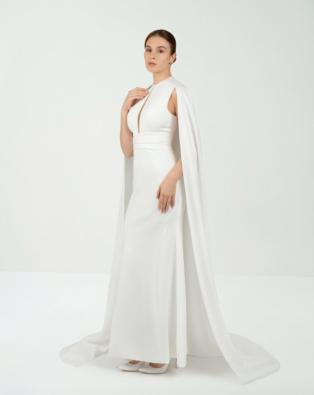 White belted dress with neckline and cape