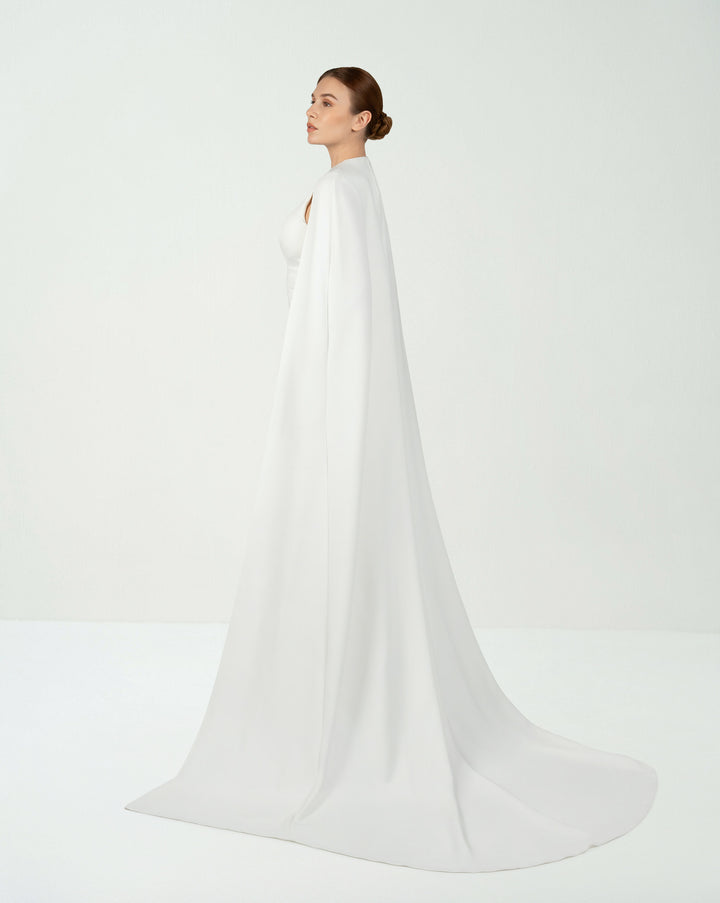 White belted dress with neckline and cape