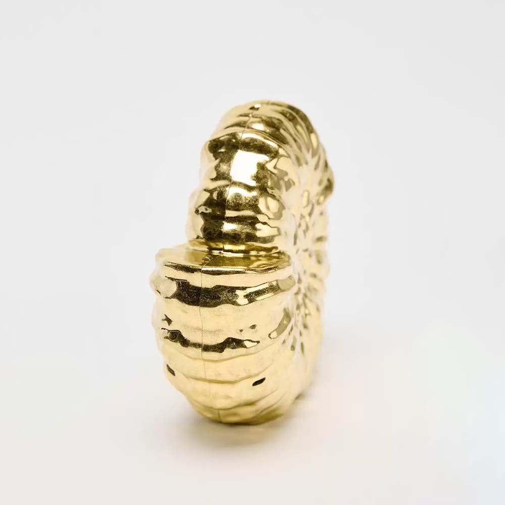 Round sculpted gold clutch with organic texture – BLOOM