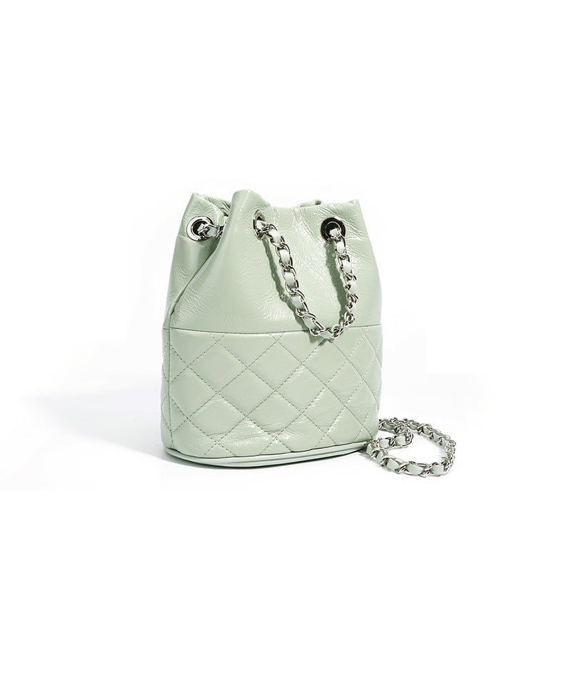 quilted metallic bucket bag with chain strap – AUMITRA