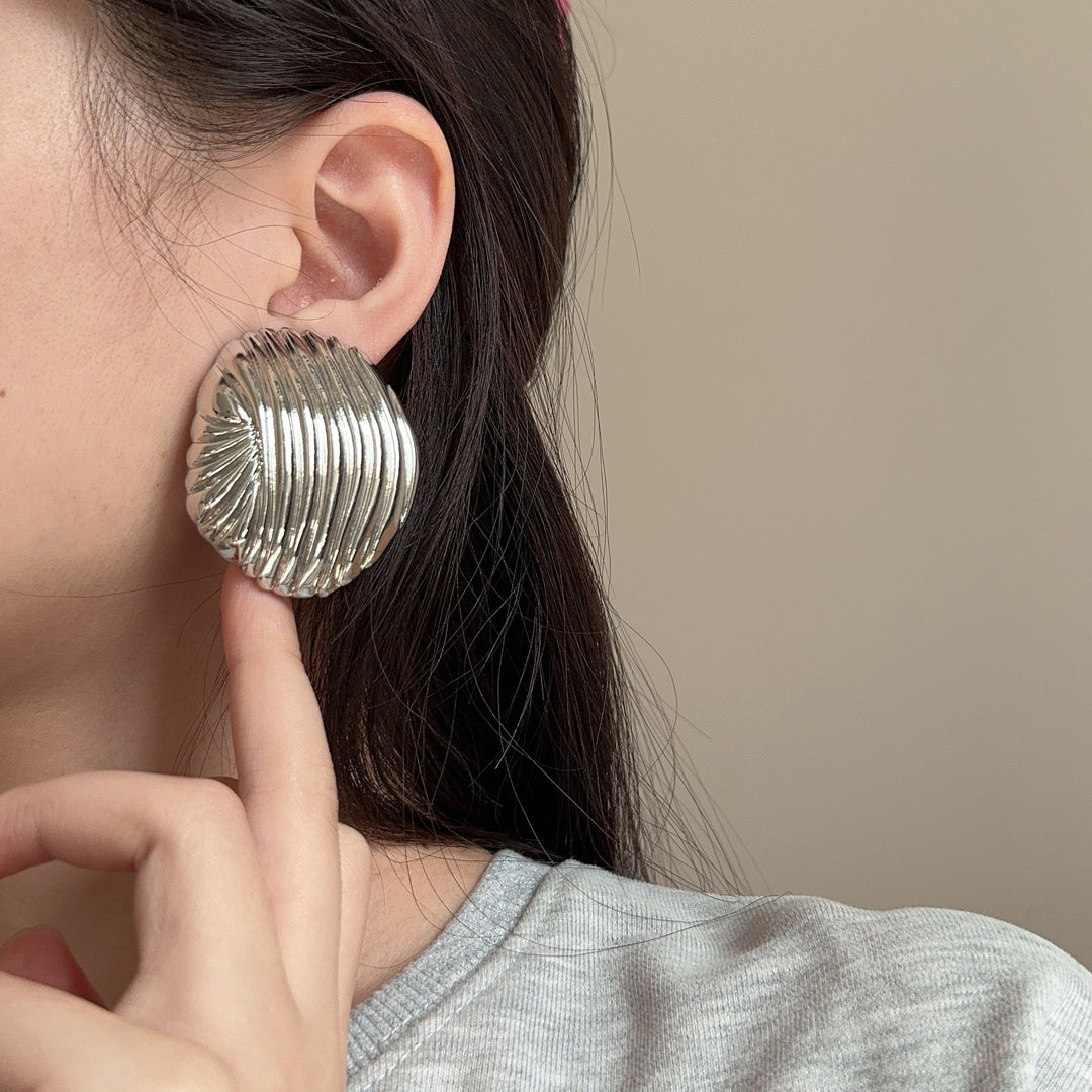 textured oval stud earrings with metallic finish - LYRANU