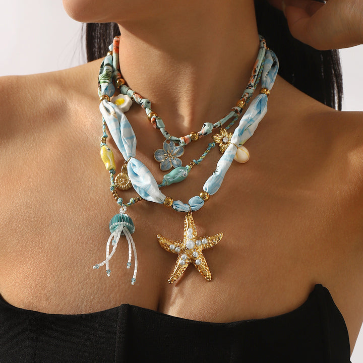 charm pendant necklace with silk and beaded accents – CORALIP