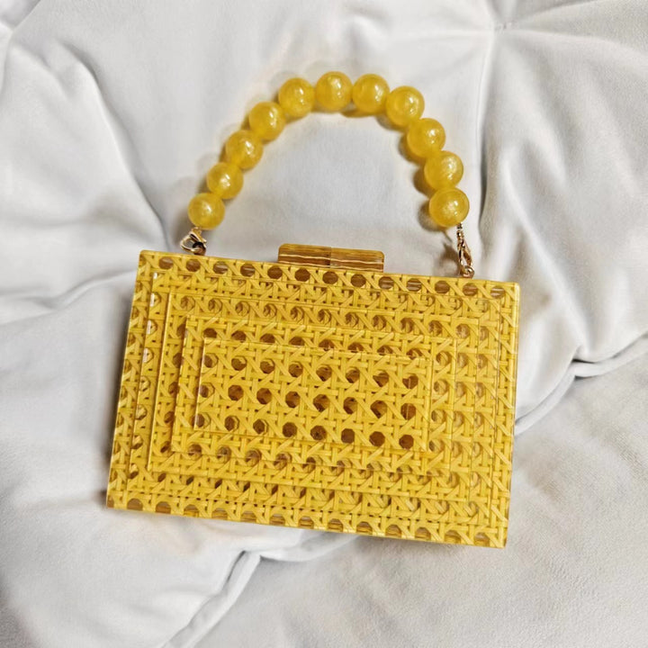 woven acrylic clutch with beaded handle – MARIGOLD
