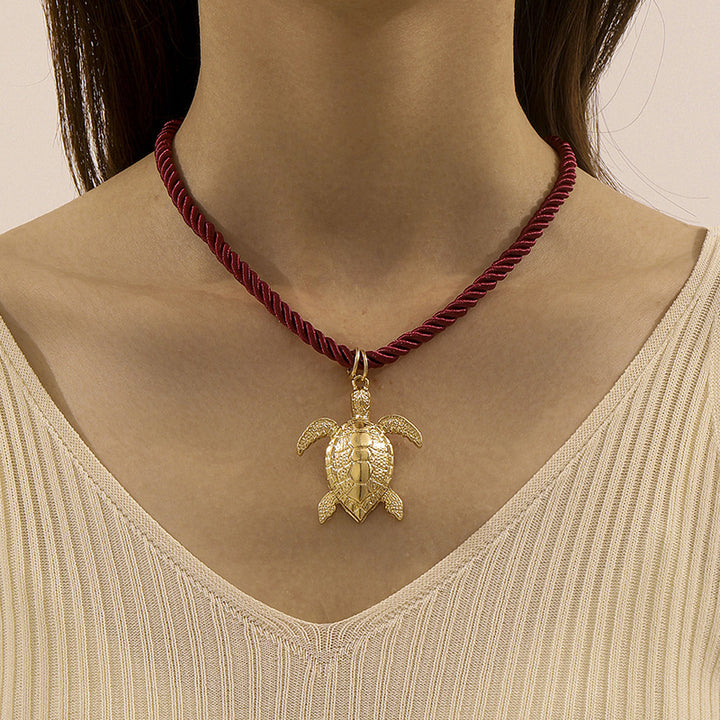 mouwloze uitlopende midi-jurk met kettingriem - CELIAV 