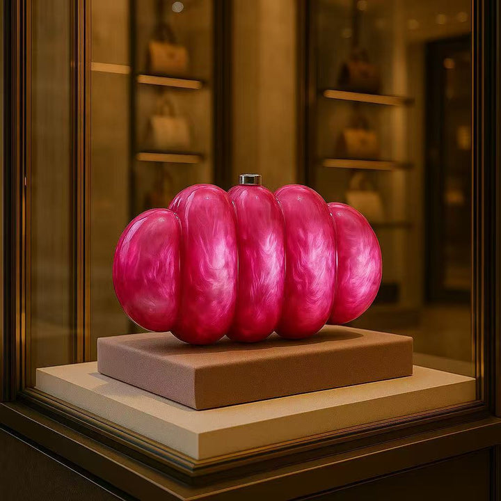 sculpted fuchsia resin clutch with glossy finish – RUBINA