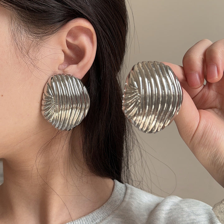 textured oval stud earrings with metallic finish - LYRANU