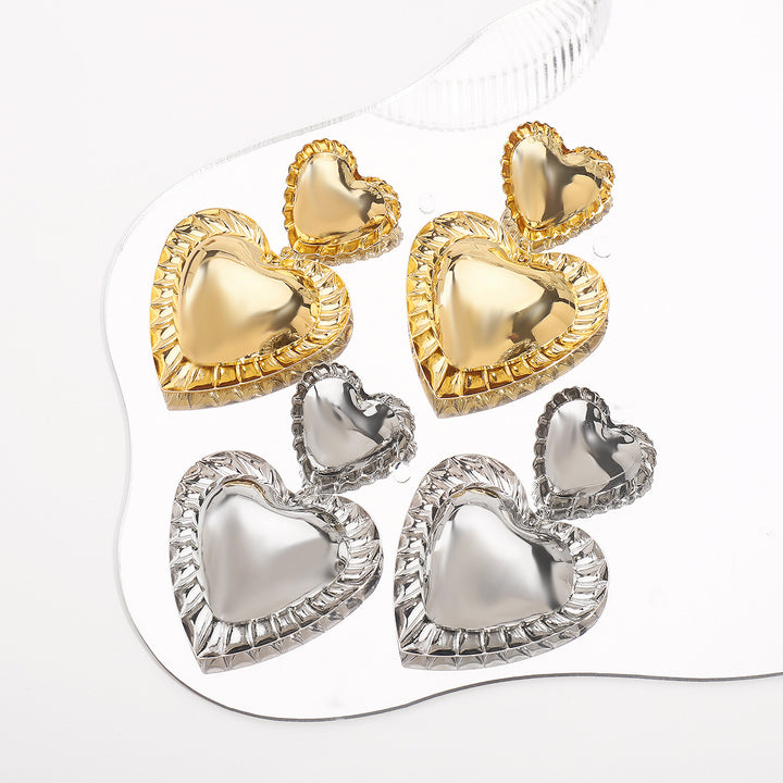 heart-shaped drop earrings with sculpted trim - CORAT