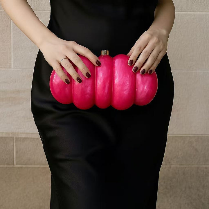 sculpted fuchsia resin clutch with glossy finish – RUBINA