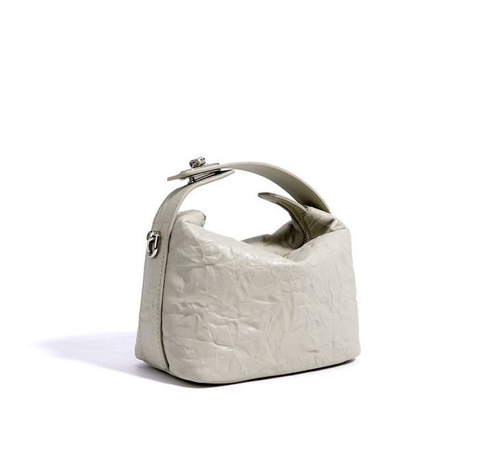 textured leather mini handbag with top handle – NOIRINTA