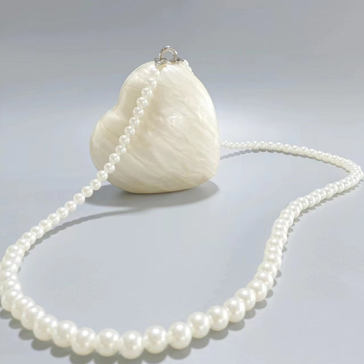 heart-shaped pearl acrylic clutch – AMOUR