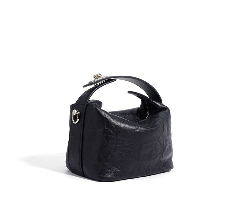 textured leather mini handbag with top handle – NOIRINTA