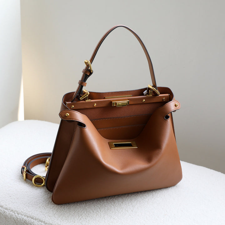 structured leather top-handle bag with gold hardware – ARIEL