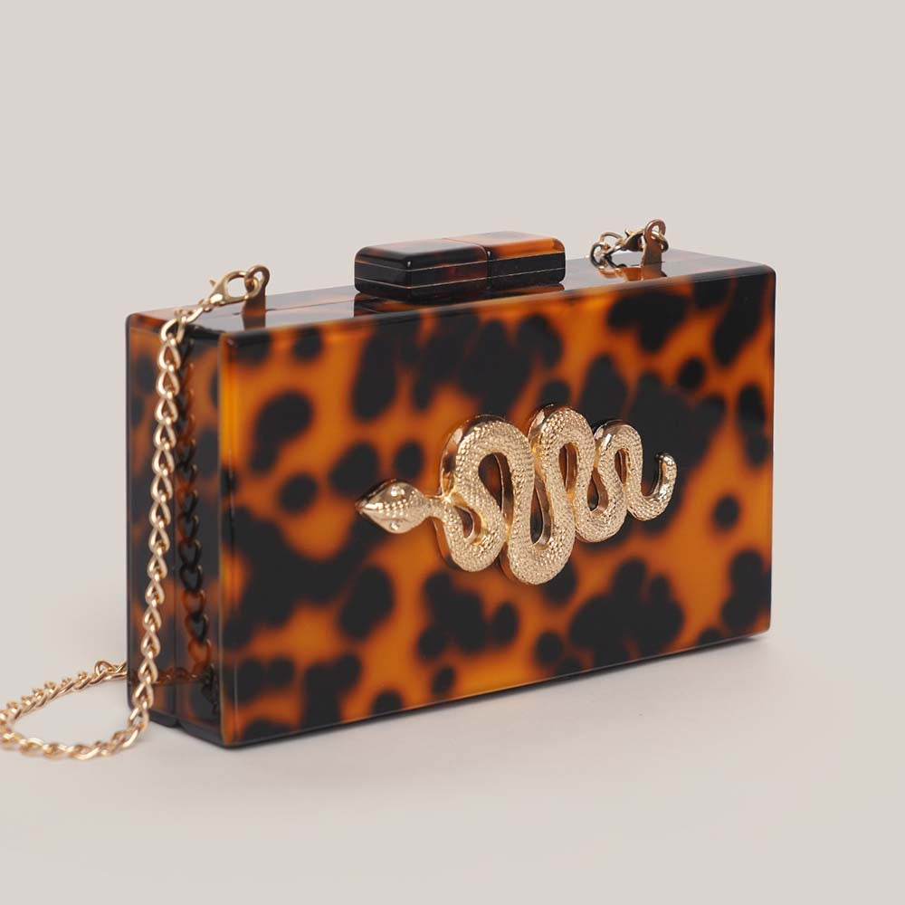 tortoiseshell acrylic clutch with gold snake detail – SERPENTIA