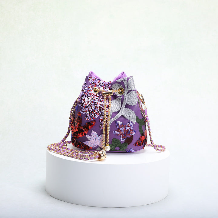 حقيبة دلو مزينة بالترتر الزهري مع حزام سلسلة – أميليير