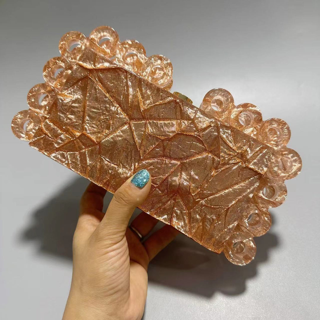 textured gold clutch with circular edge detailing – AURELIA