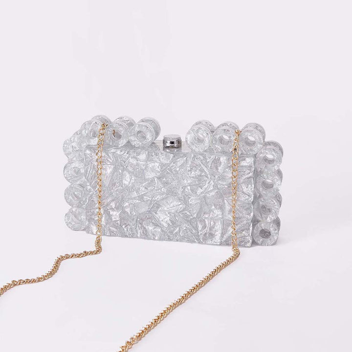 textured gold clutch with circular edge detailing – AURELIA