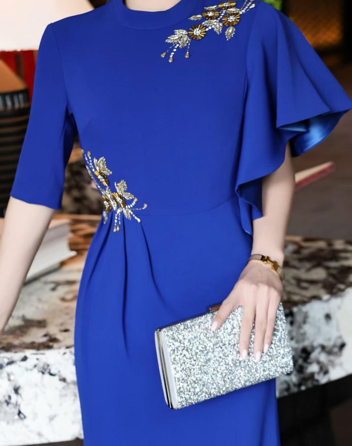 asymmetric sleeve gown with gold floral embellishments – RIVERA