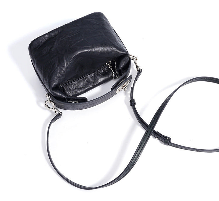 textured leather mini handbag with top handle – NOIRINTA