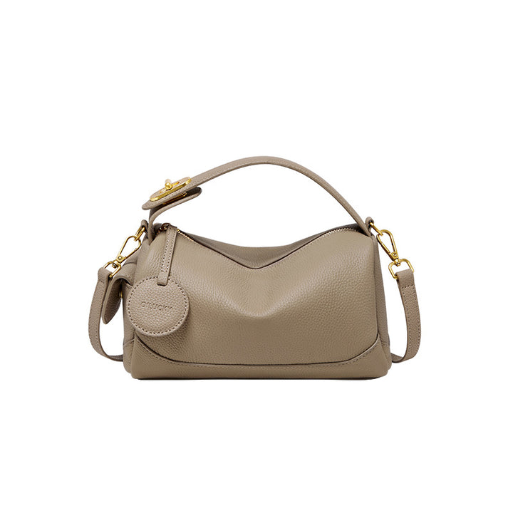 curved leather shoulder bag with gold buckle – SIRILA