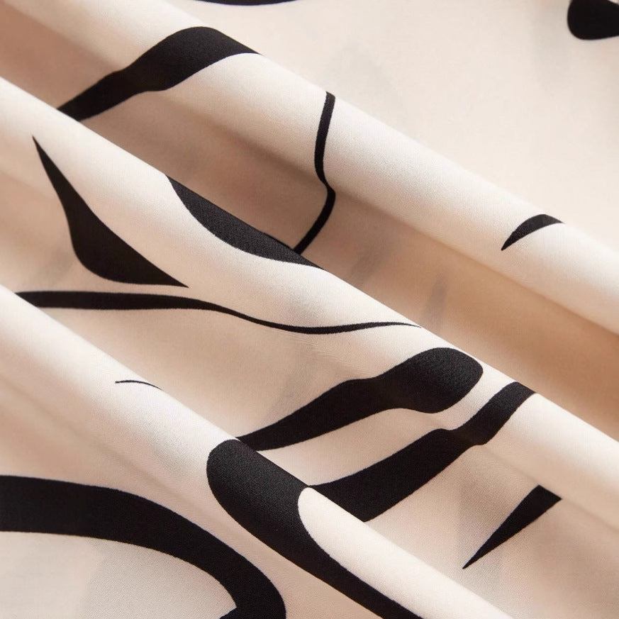 بنطال واسع الساقين بطبعة تجريدية – آريا