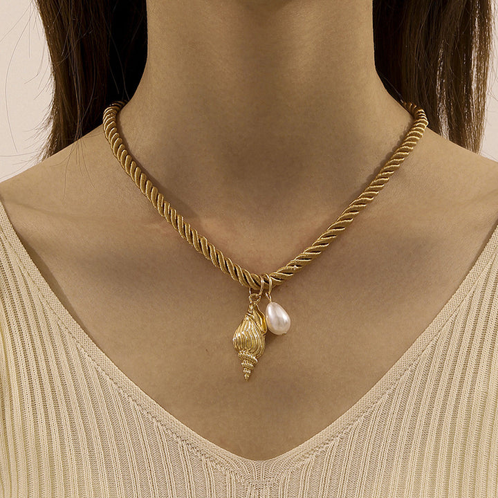 mouwloze uitlopende midi-jurk met kettingriem - CELIAV 