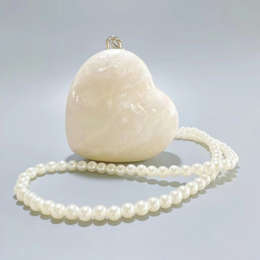 heart-shaped pearl acrylic clutch – AMOUR