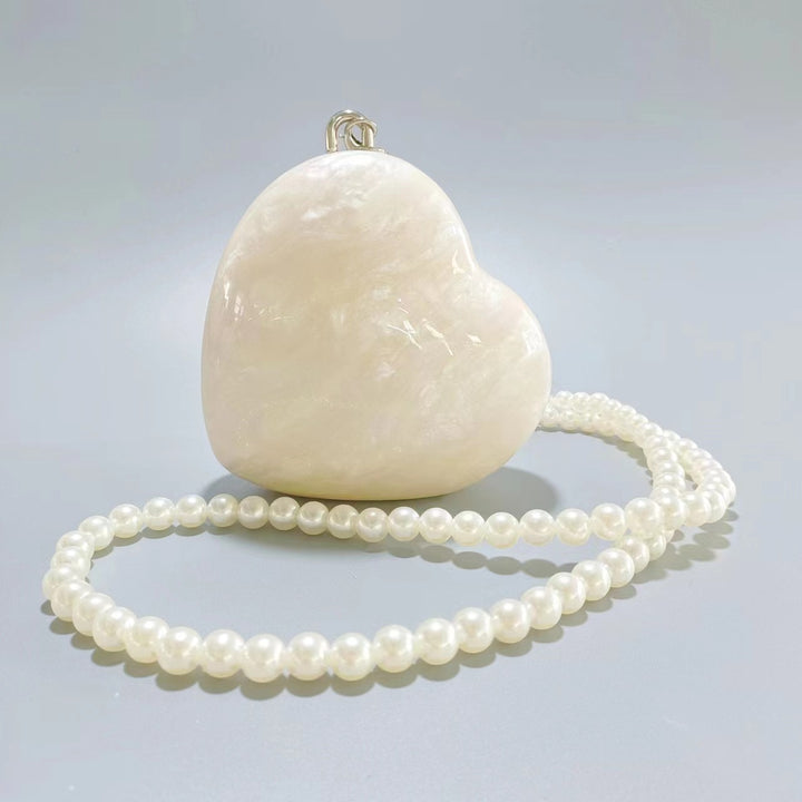 heart-shaped pearl acrylic clutch – AMOUR