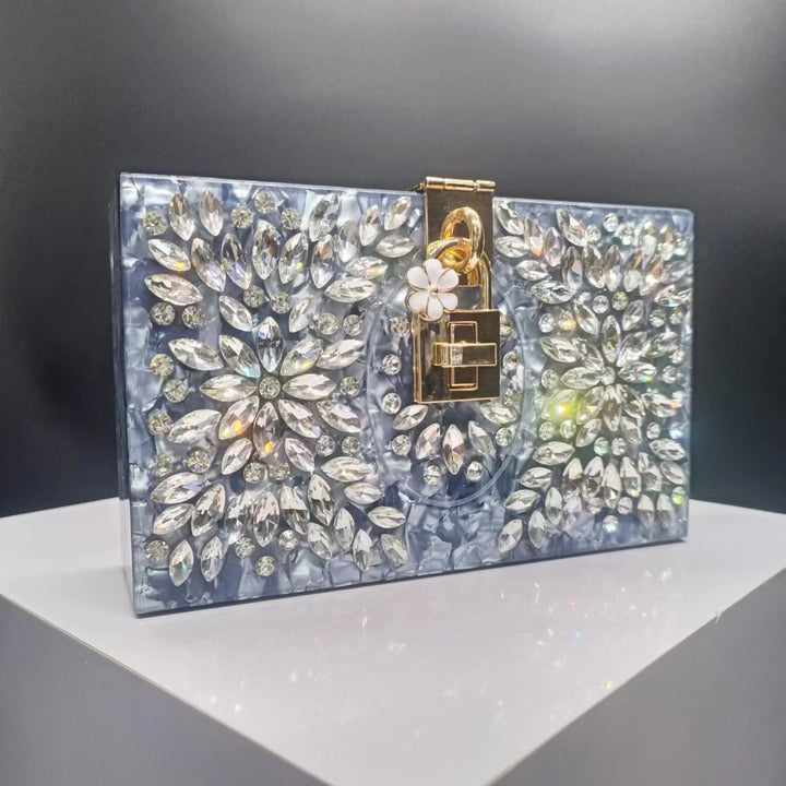 crystal-embellished acrylic clutch with floral lock – ESMENU
