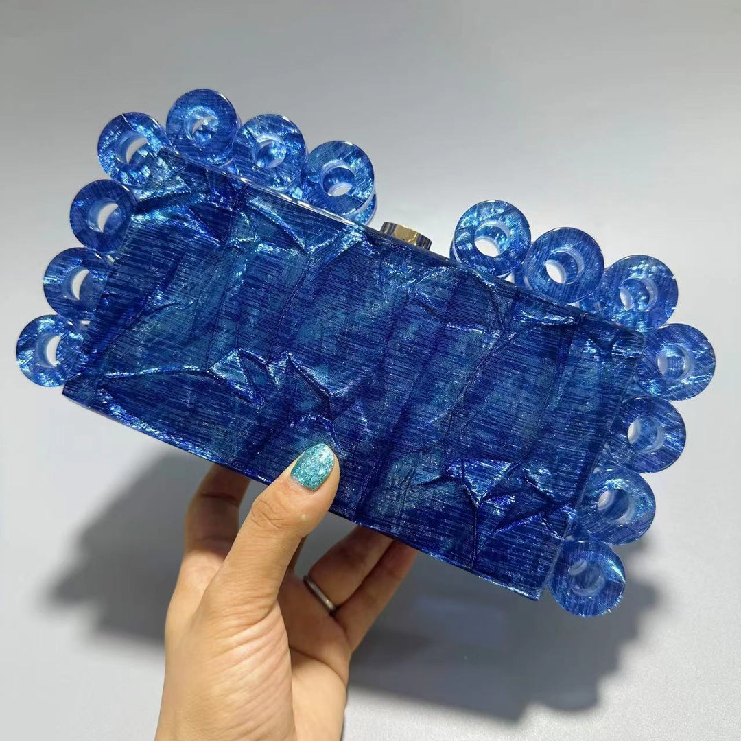 textured gold clutch with circular edge detailing – AURELIA