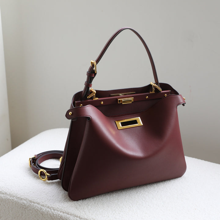 structured leather top-handle bag with gold hardware – ARIEL