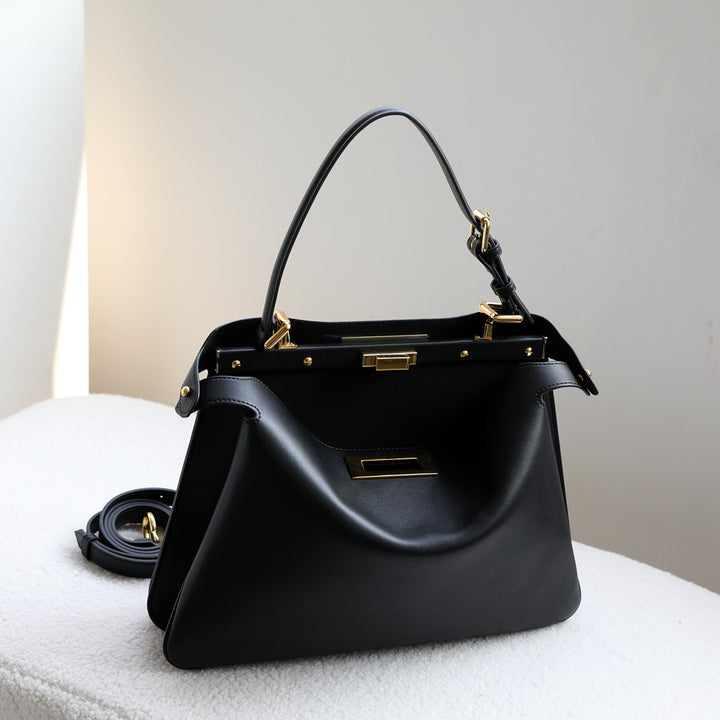 structured leather top-handle bag with gold hardware – ARIEL