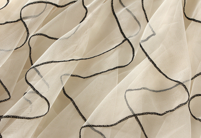 layered tulle skirt with contrast wave edging – SERENE