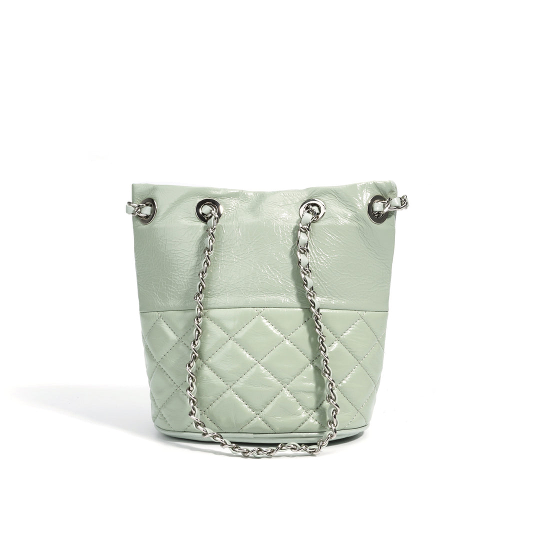 quilted metallic bucket bag with chain strap – AUMITRA
