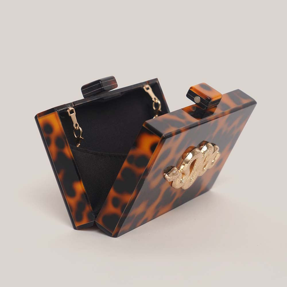 tortoiseshell acrylic clutch with gold snake detail – SERPENTIA