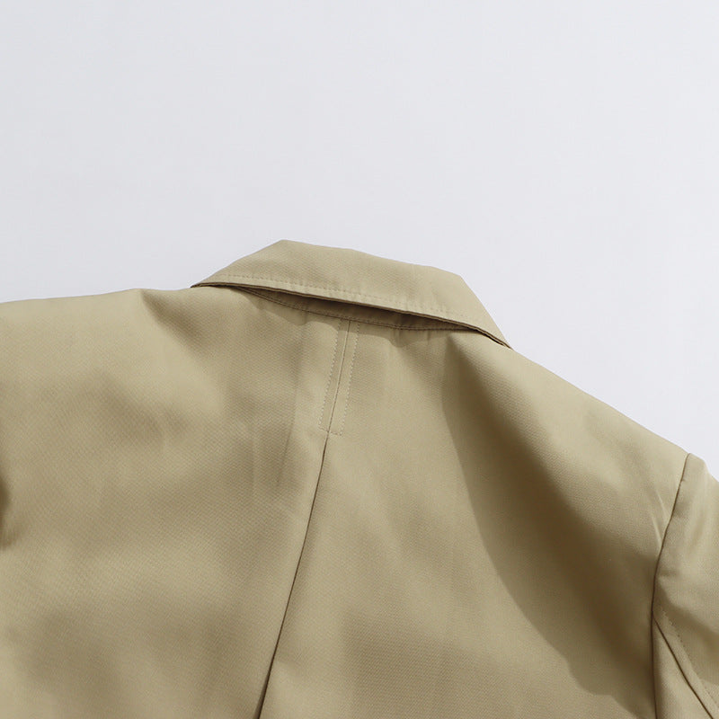 جمبسوت قصير بتصميم معطف واقٍ مزود بحزام وتفاصيل أزرار غير متماثلة - كايلا