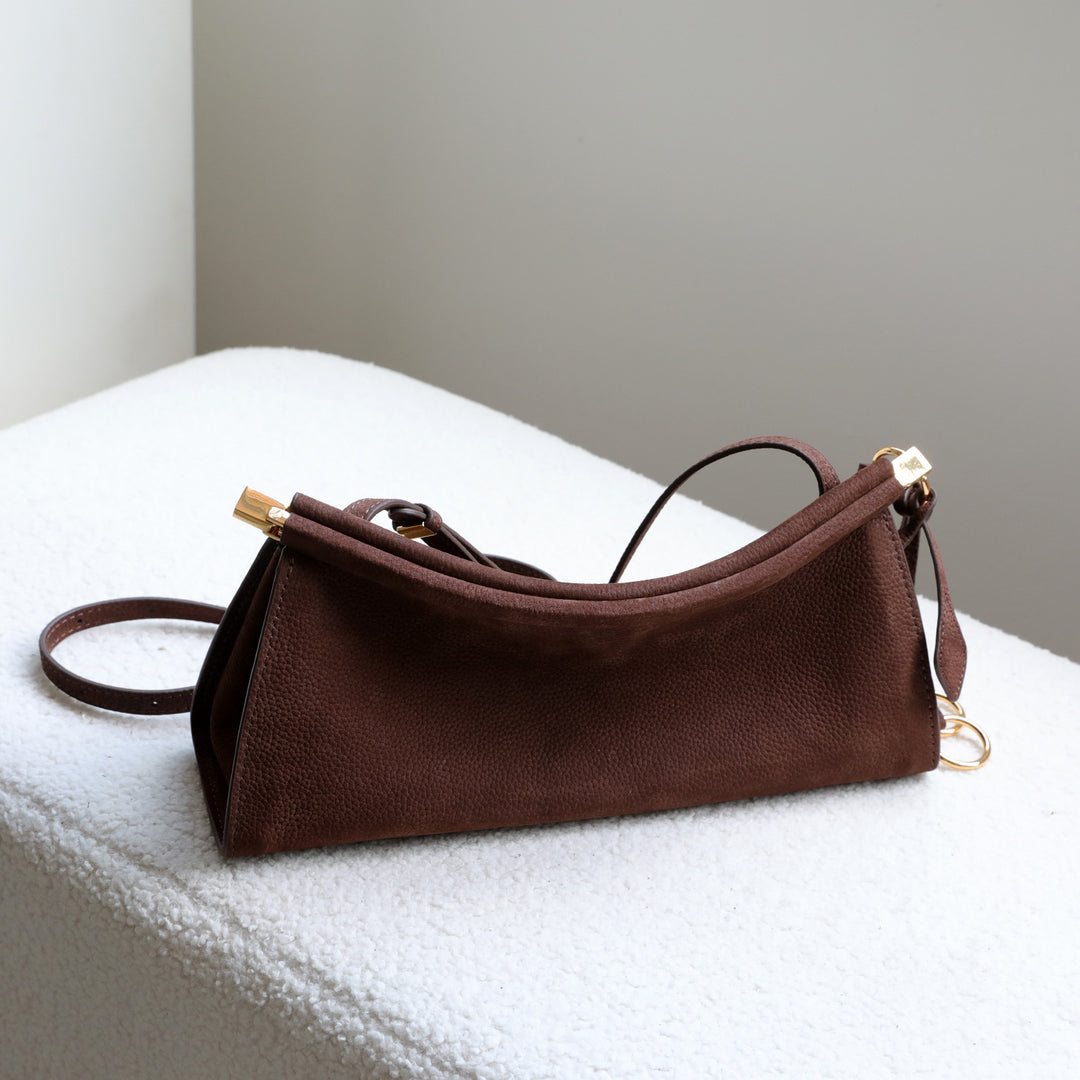 sleek leather shoulder bag with curved silhouette – ZOKSH