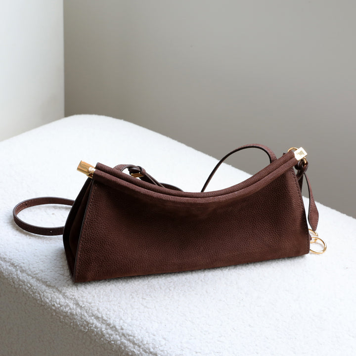 sleek leather shoulder bag with curved silhouette – ZOKSH