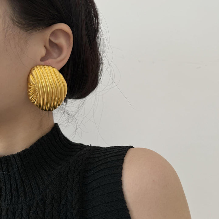 textured oval stud earrings with metallic finish - LYRANU