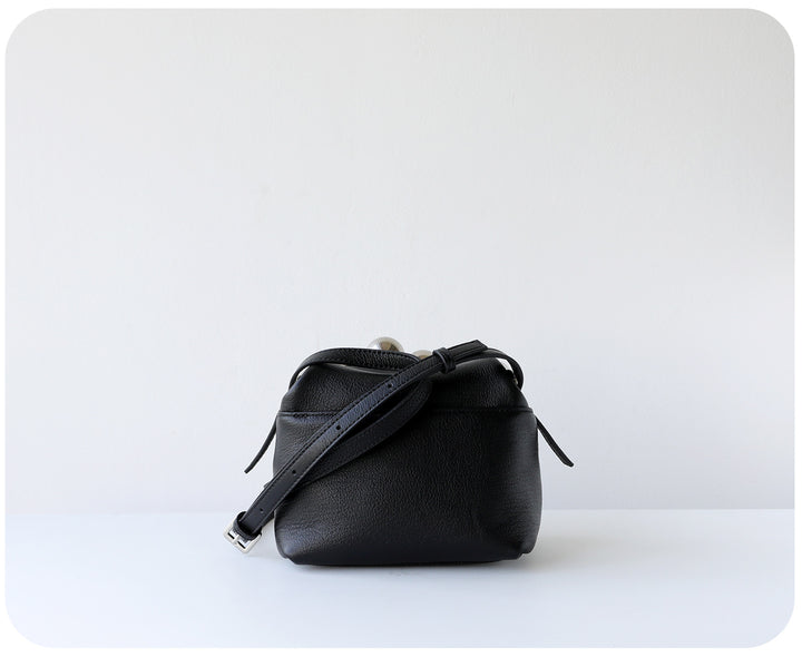 mini leather crossbody bag with metal frame clasp – YOUSF