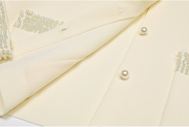 cropped tweed jacket with pearl-embellished pockets – DARAXI