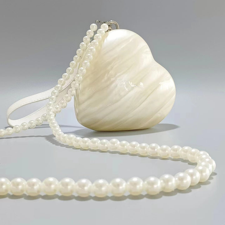 heart-shaped pearl acrylic clutch – AMOUR