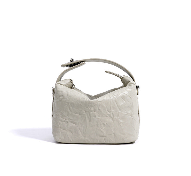 textured leather mini handbag with top handle – NOIRINTA