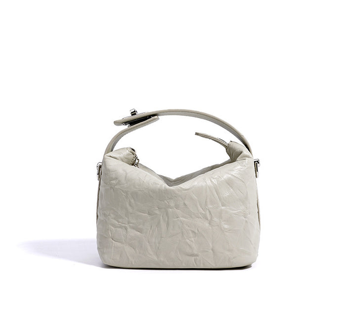 textured leather mini handbag with top handle – NOIRINTA