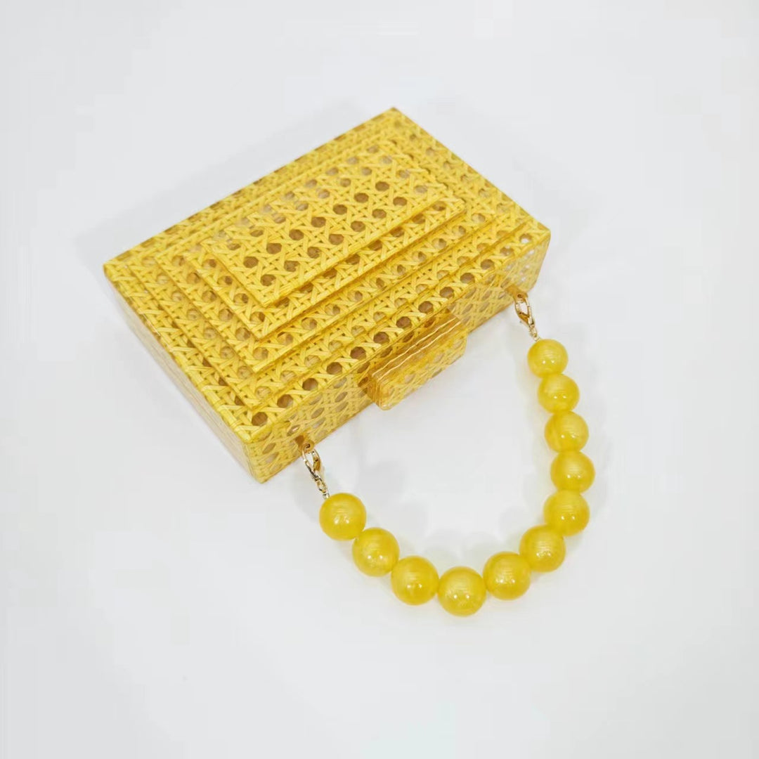 woven acrylic clutch with beaded handle – MARIGOLD