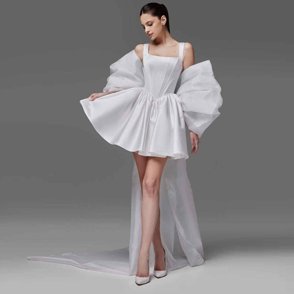 sleeveless mini dress with voluminous puff sleeves and long train - AUROKLA